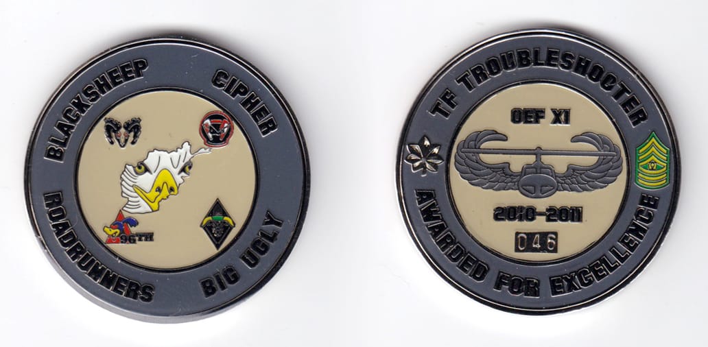 Round shaped, silver colored coin, 2 inches in diameter.