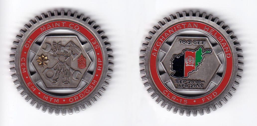 Round shaped, pewter colored coin, 2 inches in diameter.