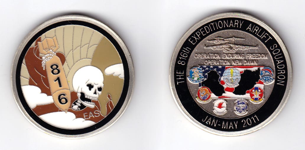 Round shaped, brass colored coin, 2 inches in diameter.