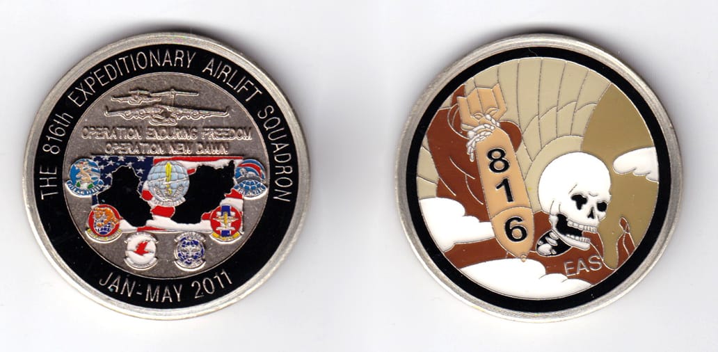 Round shaped, brass colored coin, 2 inches in diameter.