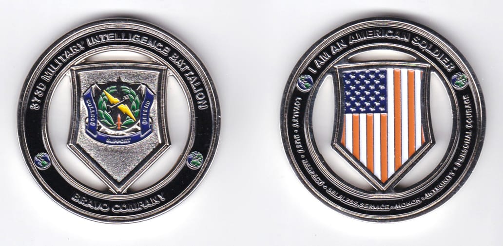 Round shaped, silver colored coin, 2 inches in diameter.