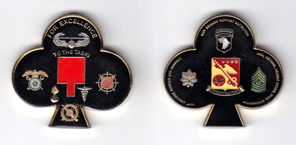 Club shaped, gold colored coin, 2 inches wide x  2 inches high.