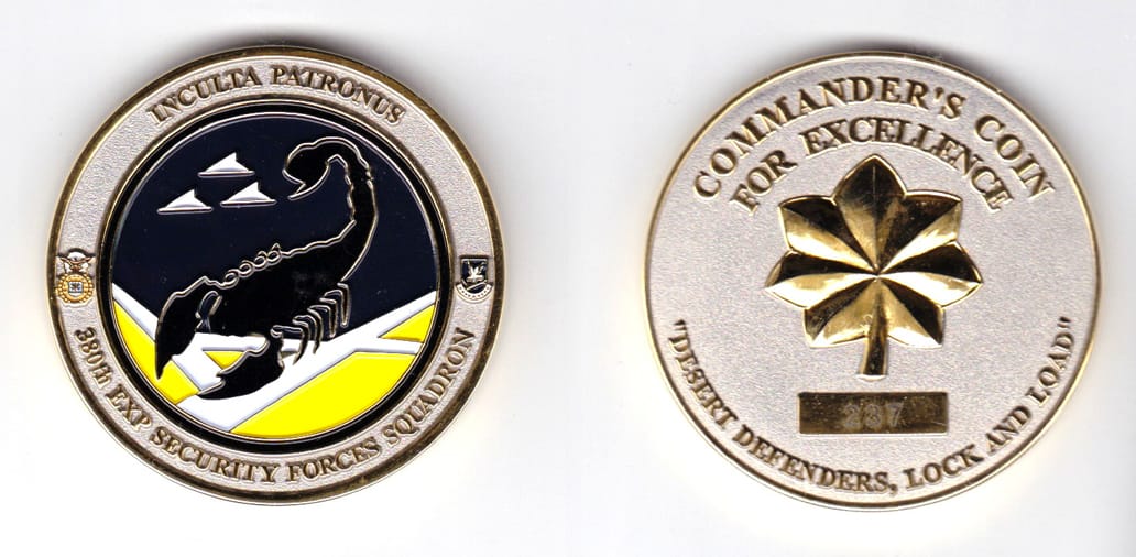 Round shaped, gold colored coin, 2 inches in diameter.