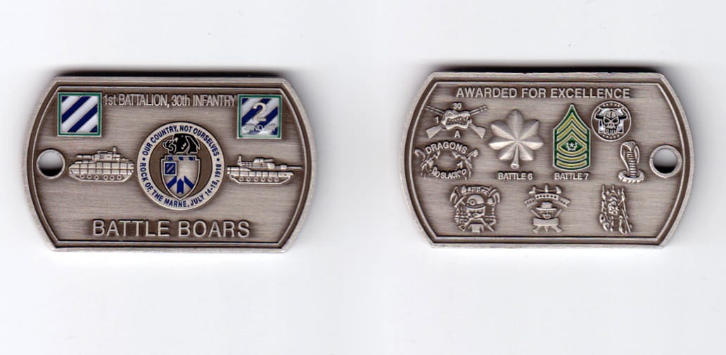 Dog tag shaped, pewter colored coin, 2 inches wide x  1-3/16 inches high.