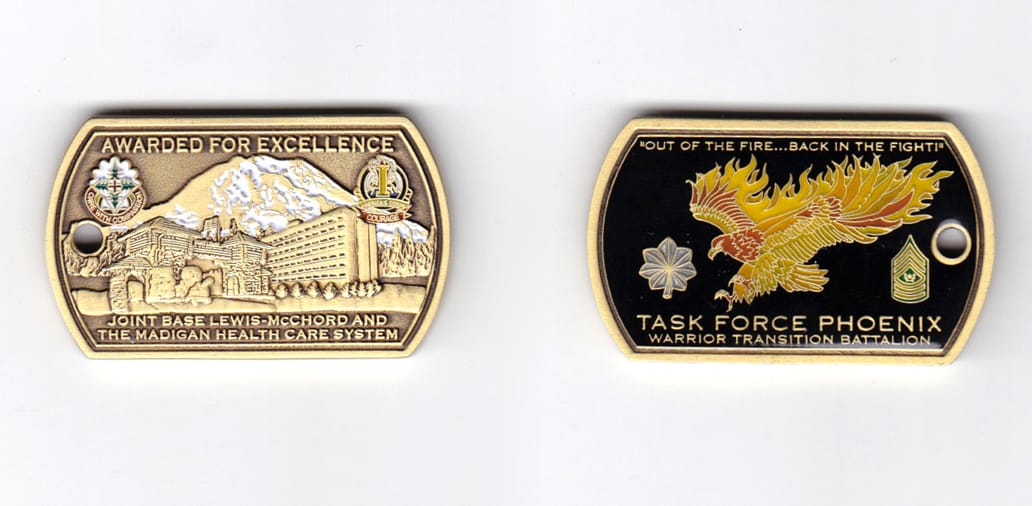 Dog tag shaped, brass colored coin, 2 inches wide x  1-3/16 inches high.