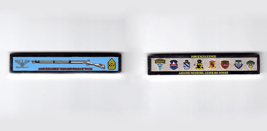 Retangular shaped, silver colored coin, 3 inches wide x  9/16 inches high.