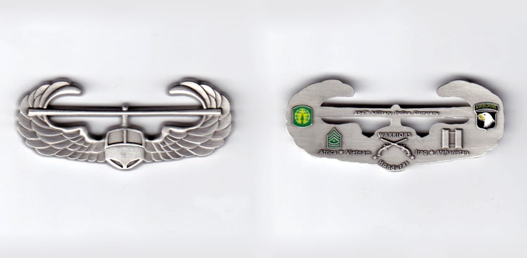 Air moble wings shaped, pewter colored coin, 2-1/2 inches wide x  1 inch high.