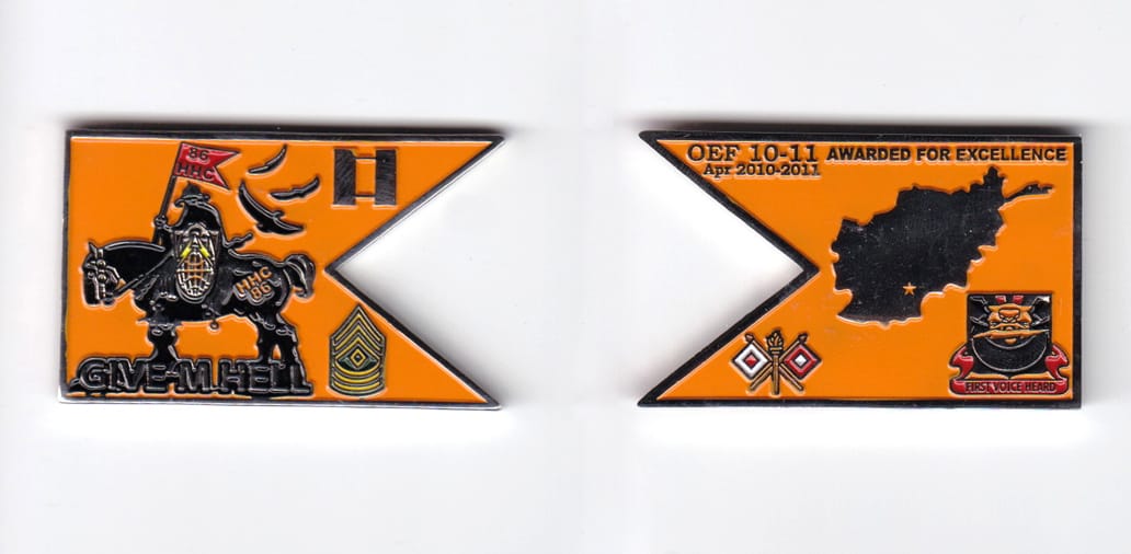 Guidon shaped, silver colored coin, 2 inches wide x  1-1/4 inches high.