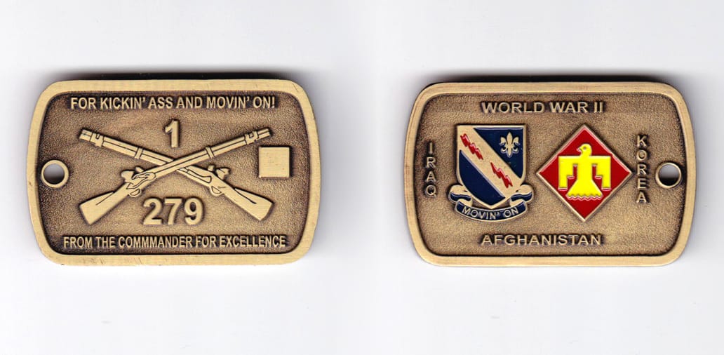 Dog tag shaped, brass colored coin, 2 inches wide x  1-1/4 inches high.