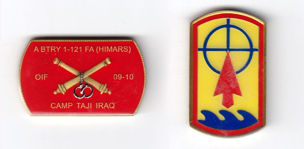 Dog tag shaped, brass colored coin, 1-3/4 inches wide x  1-1/16 inches high.