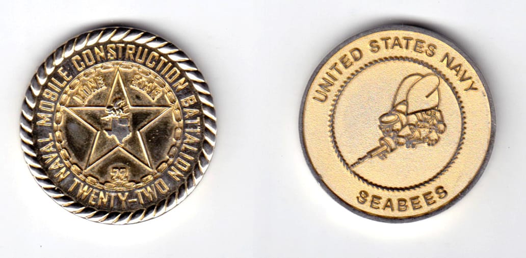 Round shaped, gold colored coin, 1-1/2 inches in diameter.