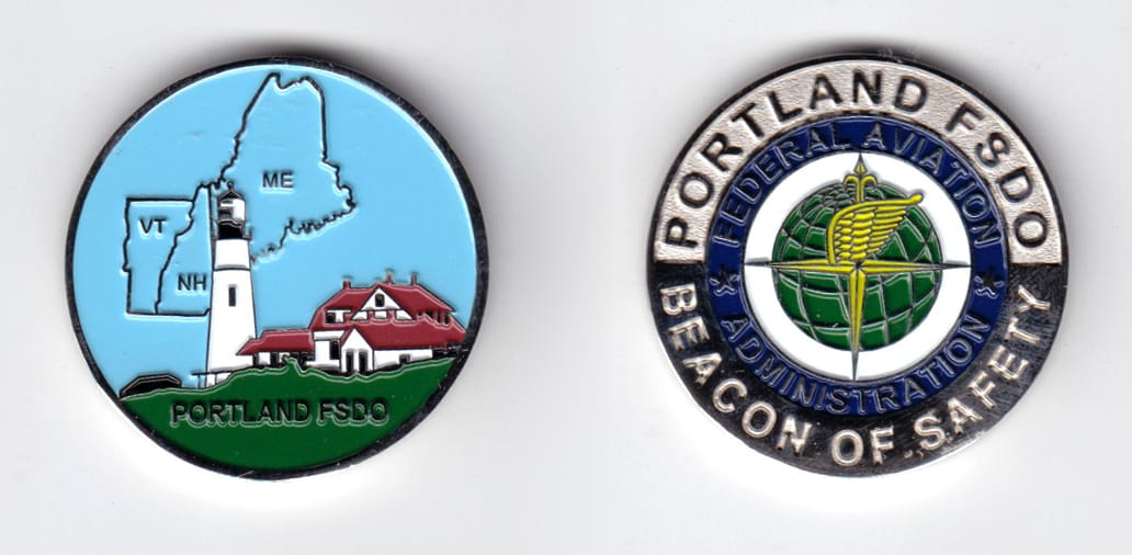 Round shaped, silver colored coin, 1-1/2 inches in diameter.