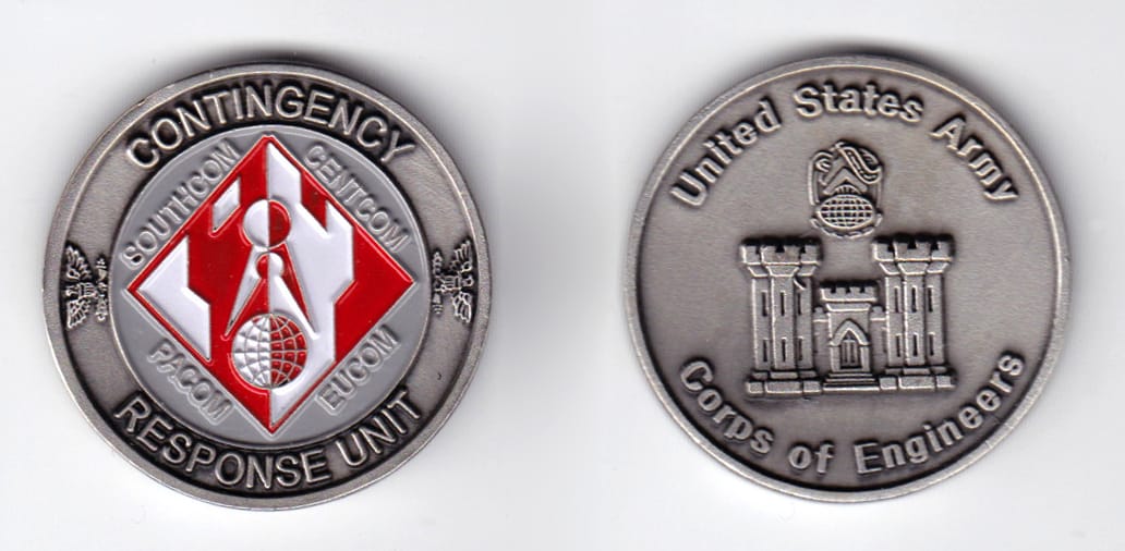 Round shaped, pewter colored coin, 1-5/8 inches in diameter.