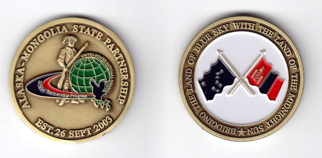 Round shaped, brass colored coin, 1-5/8 inches in diameter.