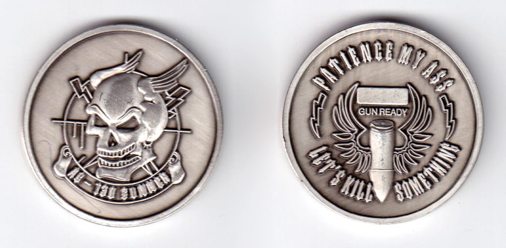 Round shaped, pewter colored coin, 1-1/2 inches in diameter.