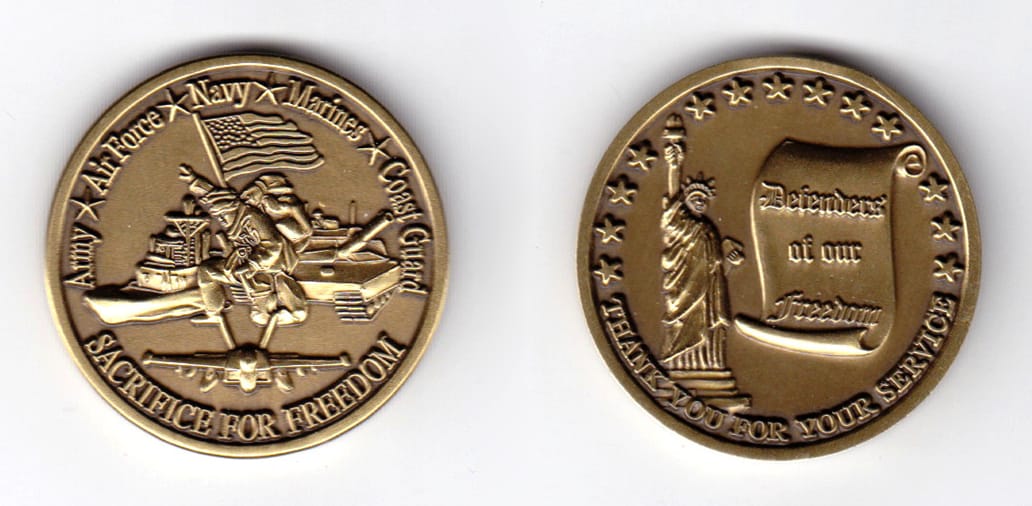 Round shaped, brass colored coin, 1-1/2 inches in diameter.