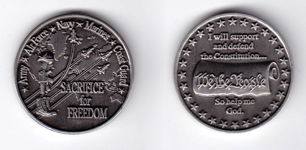 Round shaped, pewter colored coin, 1-1/2 inches in diameter.