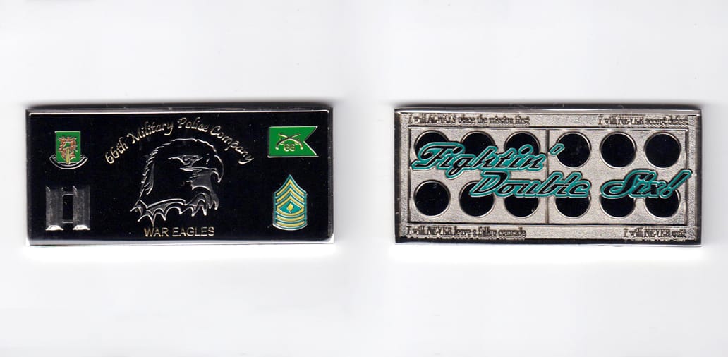 Retangular shaped, silver colored coin, 3 inches wide x  1-7/16 inches high.