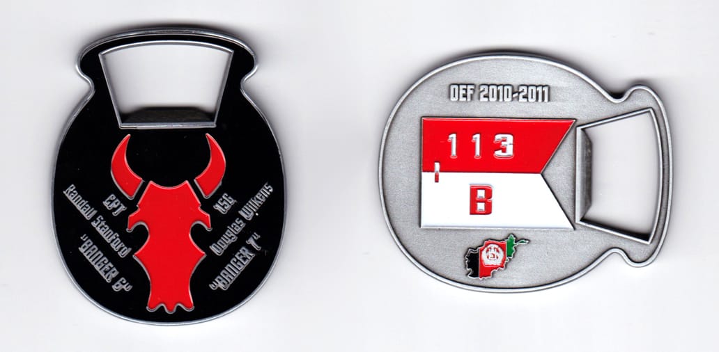 Oval shaped with bottle opener extending, pewter colored coin, 2 inches wide x  2-1/2 inches high.