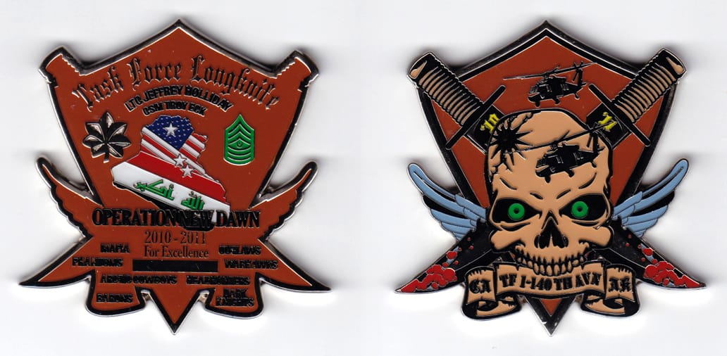 Shield shaped, with crossed daggers, wings and banner mounted beneath extending, silver colored coin, 2-1/2 inches wide ...