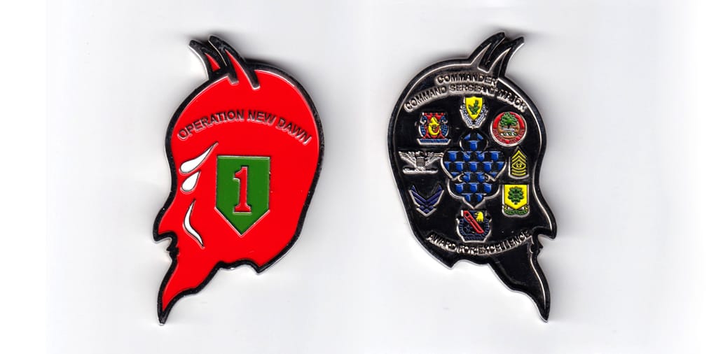 Devil's head shaped, silver colored coin, 2-1/2 inches wide x 3 inches high.