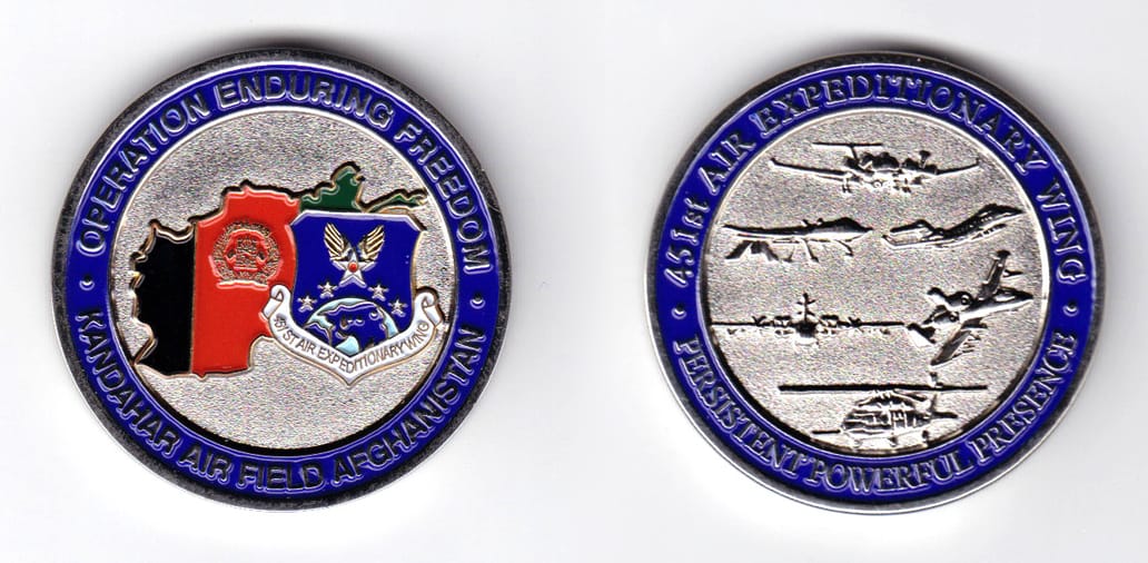 Round shaped, silver colored coin, 1-3/4 inches in diameter.