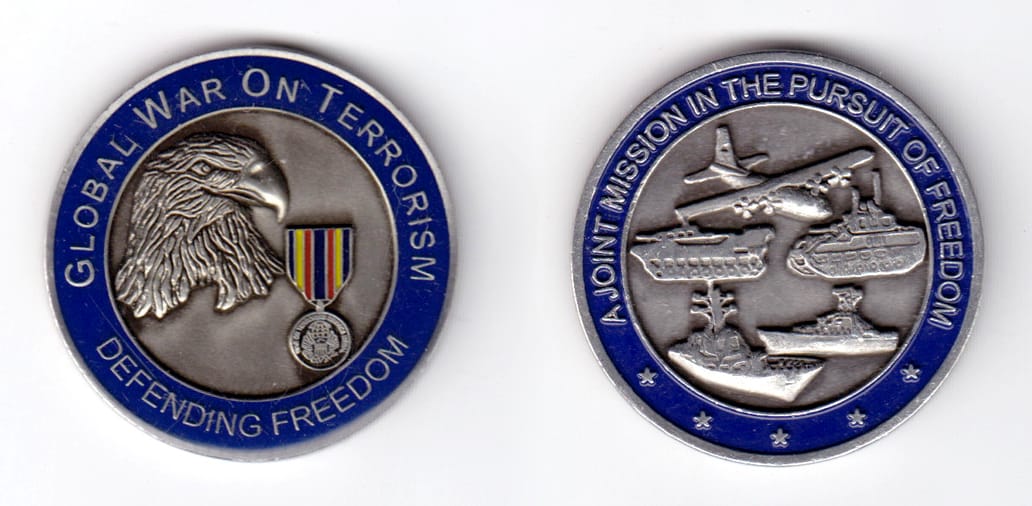 Round shaped, silver colored coin, 1 3/4 inches in diameter.