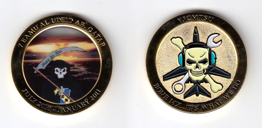 Round shaped, gold colored coin, 1-3/4 inches in diameter.