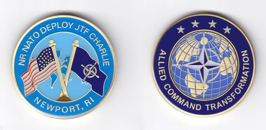 Round shaped, gold colored coin, 1-3/4 inches in diameter.