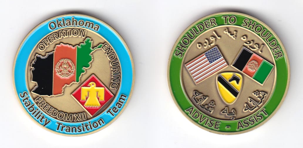 Round shaped, gold colored coin, 1-3/4 inches in diameter.