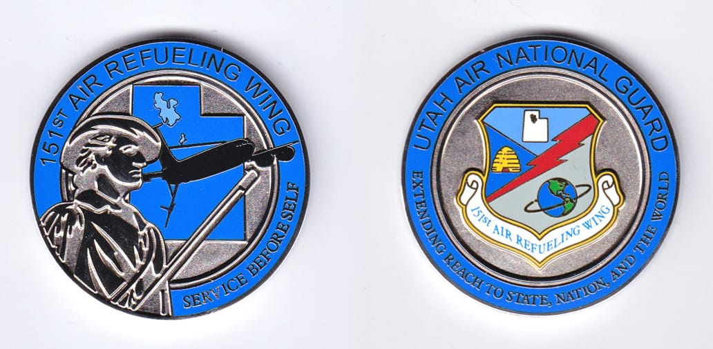 Round shaped, silver colored coin, 1-3/4 inches in diameter.