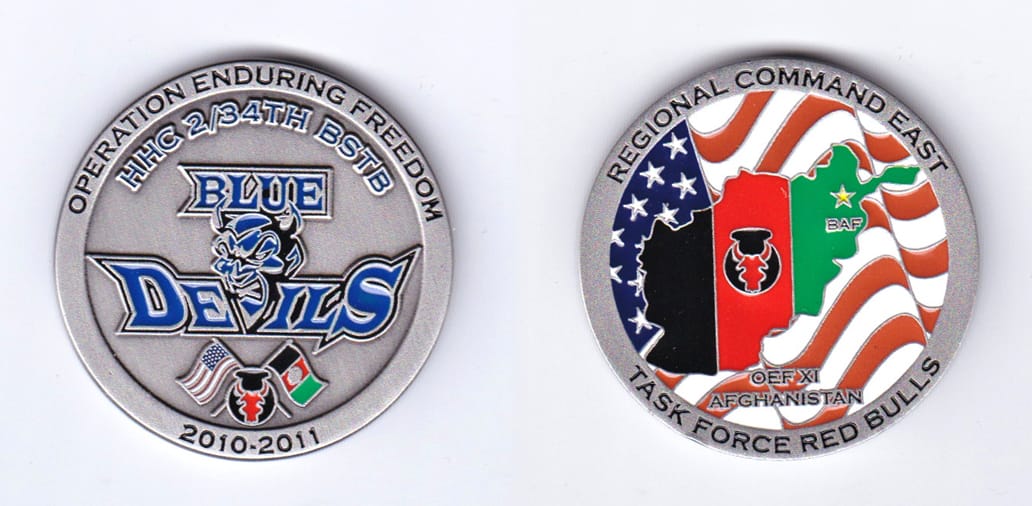 Round shaped, pewter colored coin, 1-3/4 inches in diameter.