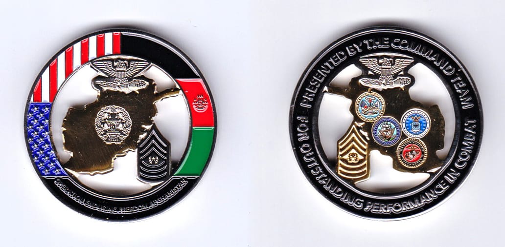 Round shaped, gold colored coin, 1-3/4 inches in diameter.