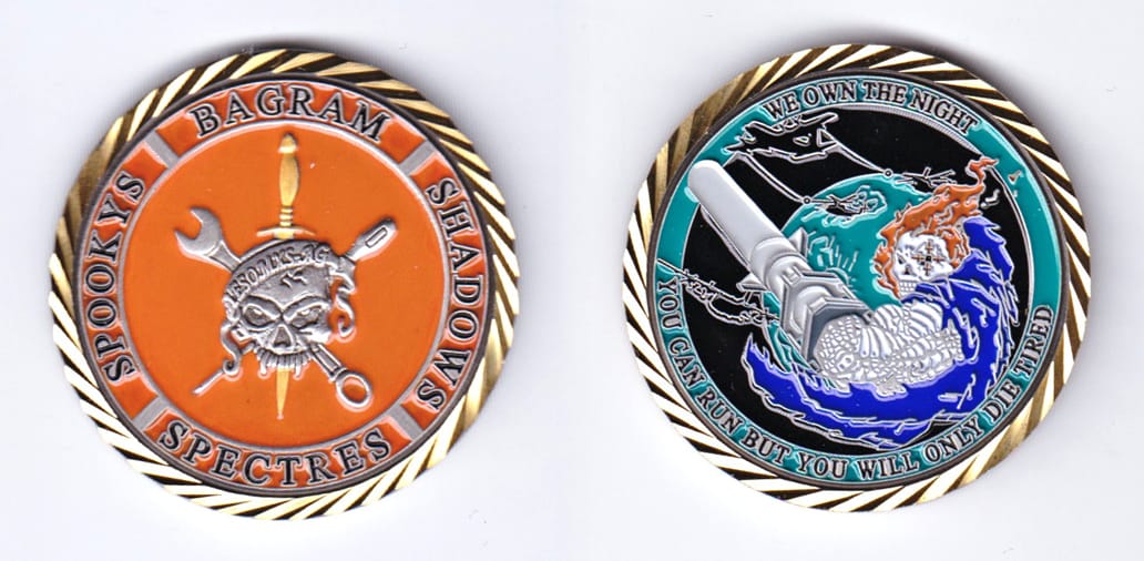 Round shaped, gold colored coin, 1-3/4 inches in diameter.