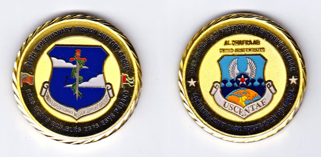 Round shaped, gold colored coin, 1-5/8 inches in diameter.