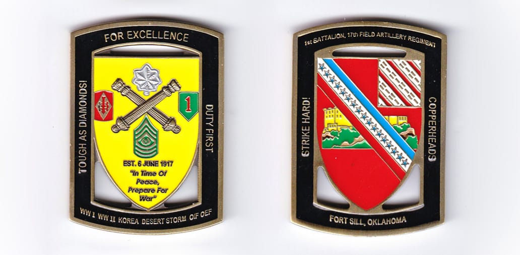 Retangular shaped with bowed top and bottom, gold colored coin, 1-3/4 inches wide x 2-1/4 inches high.