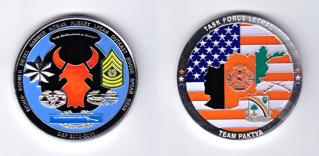 Round shaped, silver colored coin, 2 inches in diameter.