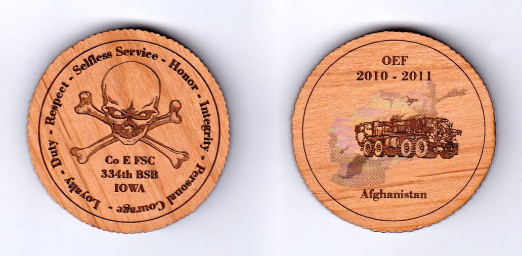 Round shaped,  wooden coin, 2 inches in diameter.