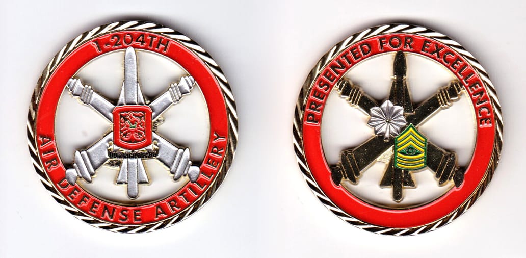 Round shaped, gold colored coin, 2 inches in diameter.