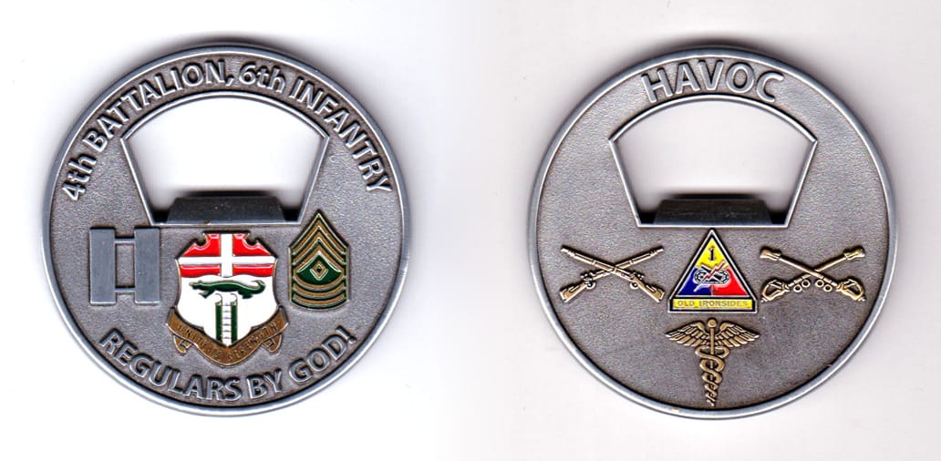 Round shaped, pewter colored coin, 2 inches in diameter.