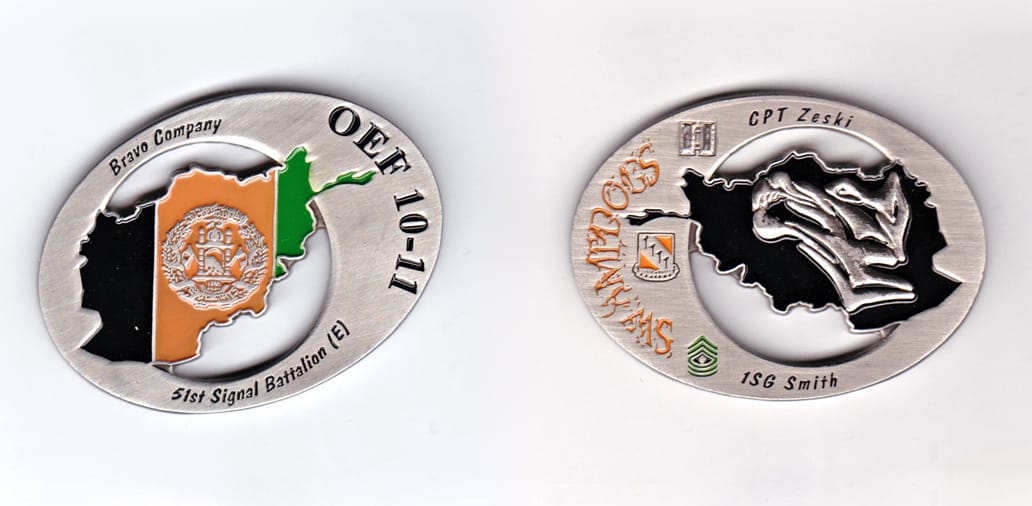 Oval shaped, pewter colored coin, 2-1/2 inches wide x 1-5/8 inches high.