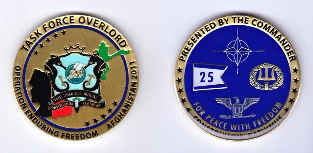 Round shaped, gold colored coin, 2 inches in diameter.