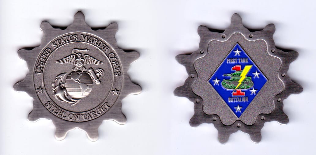 Sprocket shaped, silver colored coin, 2 inches in diameter.