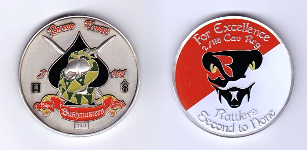 Round shaped, pewter colored coin, 2 inches in diameter.