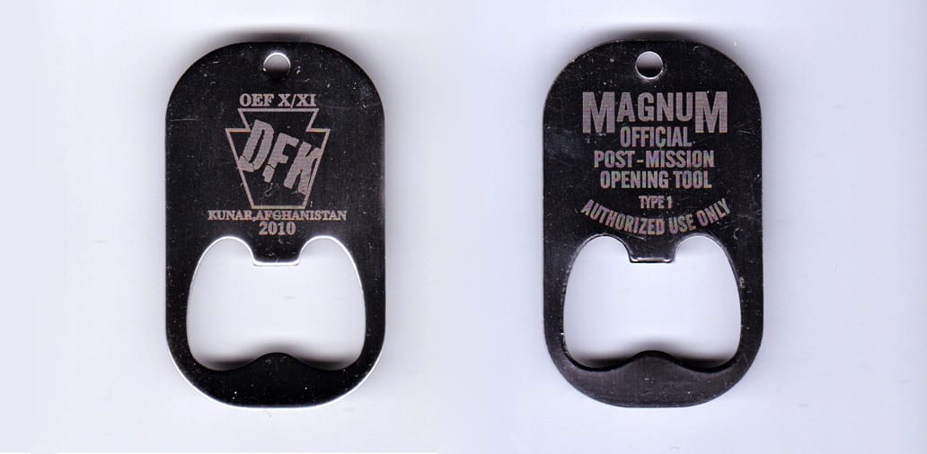 Dog tag shaped, with bottle opener, silver colored coin, 1-1/4 inches wide x 2 inches high.