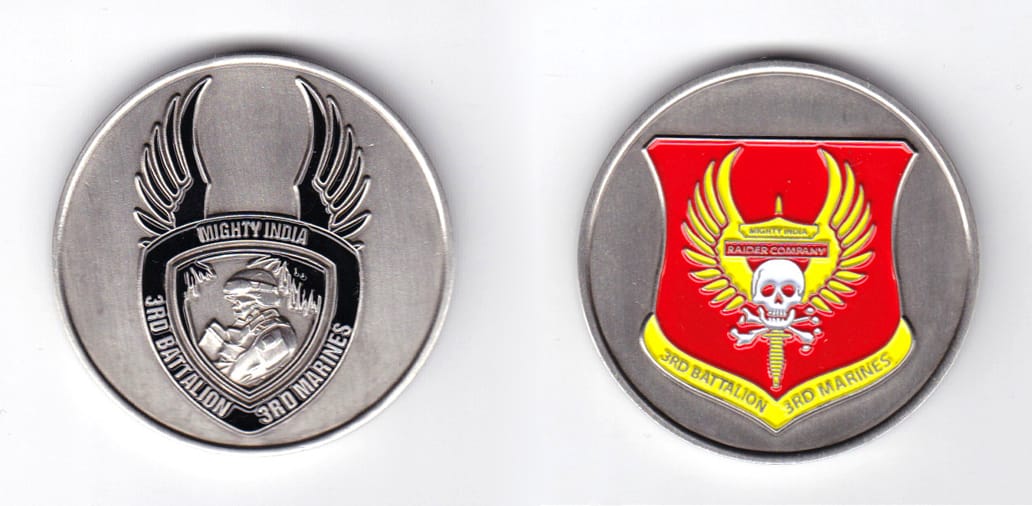 Round shaped, pewter colored coin, 1-3/4 inches in diameter.