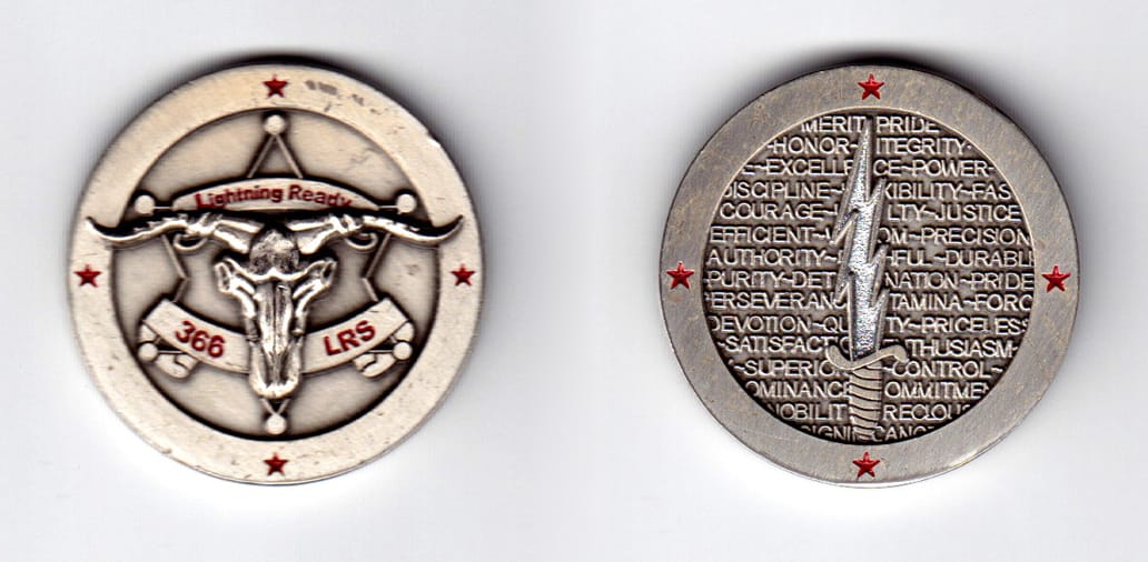 Round shaped, pewter colored coin, 1-9/16 inches in diameter.