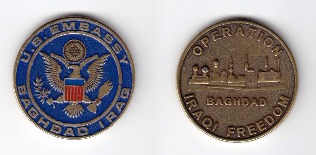 Round shaped, antique brass colored coin, 1-9/16 inches in diameter.