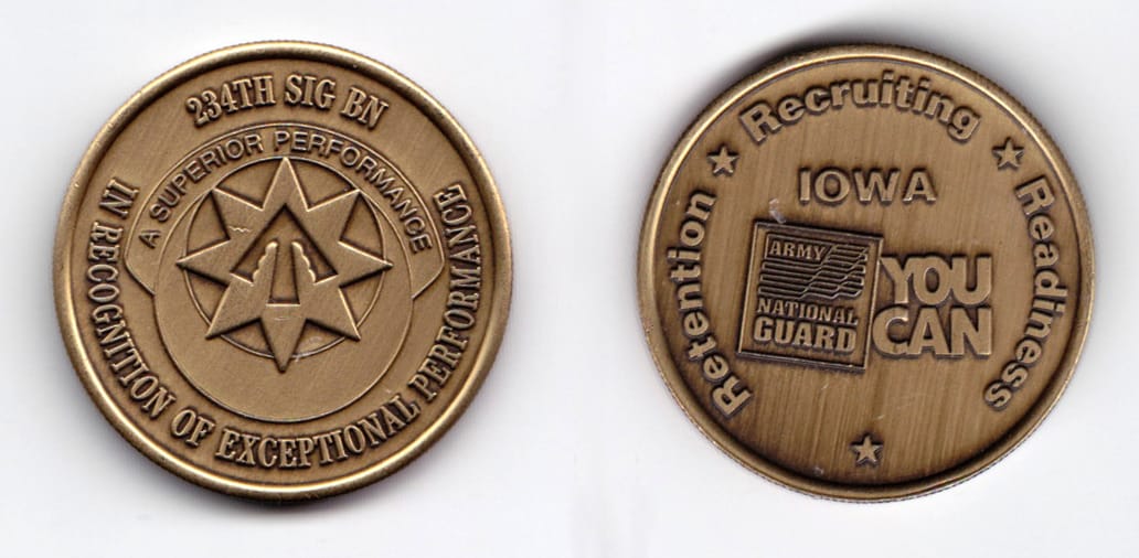 Round shaped, brass colored coin, 1-9/16 inches in diameter.