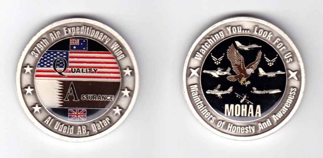 Round shaped, pewter colored coin, 1-9/16 inches in diameter.